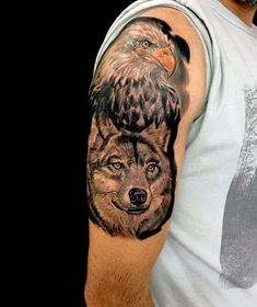 a man with an eagle and wolf tattoo on his arm