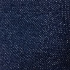 the texture of blue denim fabric is very close to the camera's eye level