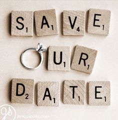 the word save our date spelled with scrabbles and a ring on top