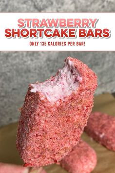 strawberry shortcake bars on a wooden cutting board with the title overlay reads, strawberry shortcake bars only 150 calories per bar