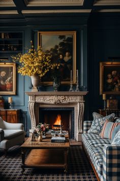 a living room filled with furniture and a fire place next to a painting on the wall