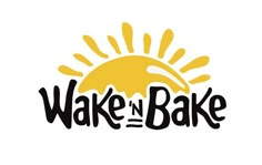 wake in the bake logo with sun and clouds above it on a white background