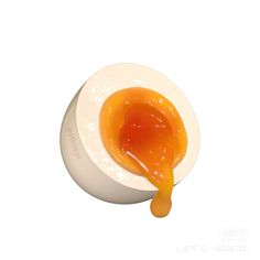 an orange sauce is being poured into a white bowl on a white surface with the lid open