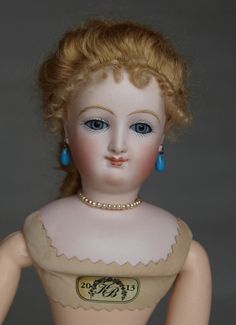 a doll with blonde hair and blue eyes