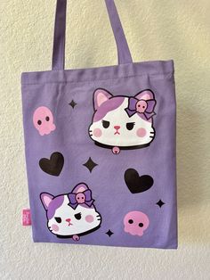 This adorable tote bag has designs on both sides. It's perfect for everyday use! Kuromi inspired 💜 Item Details: ♡Heat transfer printed front and back designs♡Pocket with zipper for phone and key♡Zipper on the top of the bag♡Length 34 x Height 40 cm♡Handle 2.5 x 56 cm How to care: Gentle wash with water, please avoid using harsh detergents and soaps. Trendy Bags With Cartoon Print For Daily Use, Trendy Cartoon Print Bags For Daily Use, Cute Bags With Cartoon Print For Everyday Use, Kawaii Shoulder Bag With Cat Design For Daily Use, Cute Cartoon Print Bags For Everyday Use, Cute Everyday Bags With Cartoon Print, Kawaii Cat Design Shoulder Bag For Daily Use, Pink Cartoon Print Bag For Everyday Use, Purple Kawaii Bags For Everyday Use