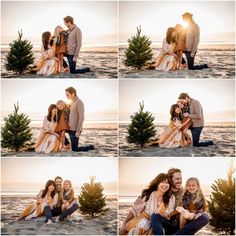 four people are hugging each other on the beach with trees in the foreground and sunset behind them