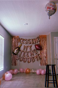 a party room with balloons, streamers and decorations