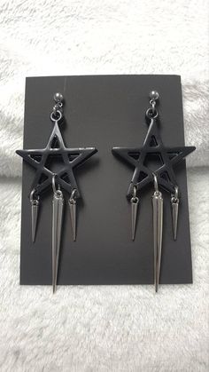 Looking for something with a witchy vibe? Then these black pentagram earrings are the right thing for you.  - Resin cast black pentagram, approximately 50 mm wide  - Buckles and studs are made of stainless steel, so they are suitable for those who are allergic to nickel  - Acrylic spike, 50 mm long  - Acrylic spikes, 24 mm long You can choose safety clips from stainless steel or silicone.  You can fit them into any outfit and these are some of the ideas: They will look great on a tight gothic dress, a wide grunge vest or a shirt. Complete your witchy Wiccan with these beautiful earrings.  I am at your service for all information.  Thank you for your interest in my work and support.  Follow me on the social networks listed below.  Facebook: www.facebook.com/KalitheaAlternativeAccessories  I Alternative Style Black Earrings For Gift, Alternative Black Earrings For Halloween, Black Metal Grunge Earrings, Gothic Black Nickel-free Plug Earrings, Nickel-free Gothic Black Plug Earrings, Nickel Free Black Alternative Earrings, Alternative Style Nickel-free Black Earrings, Alternative Style Black Nickel-free Earrings, Black Metal Edgy Plug Earrings