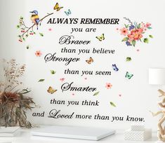 there is a wall decal that says, always remember you are braver than you believe