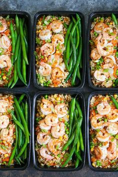 six plastic trays filled with shrimp and rice