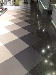 a checkered floor in an airport lobby