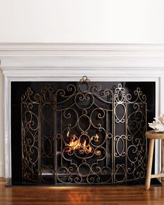 a fire place in a living room next to a table