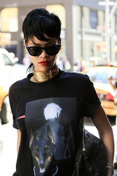 a woman wearing sunglasses and a t - shirt with an image of a dog on it