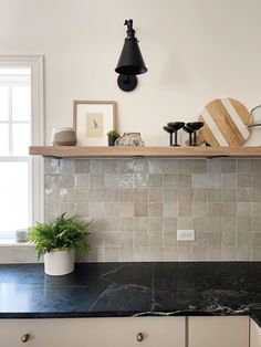 the kitchen counter is clean and ready to be used as a shelf for cooking utensils