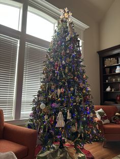 a decorated christmas tree in a living room