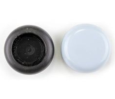 two black and white knobs are next to each other