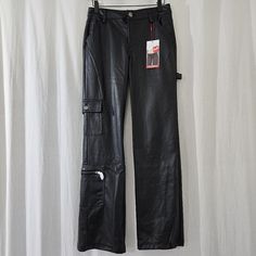 New With Tags. Two Available. Black Y2k Pants For Fall, Y2k Black Fall Pants, Black Y2k Cargo Trousers, Y2k Black Cargo Trousers, Fitted Black Leather Pants With Pockets, Edgy Straight Leg Leather Pants With Pockets, Black Y2k Bottoms With Pockets, Y2k Style Black Bottoms With Pockets, Black Straight Leg Leather Pants With Pockets