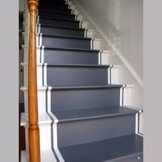 the stairs are painted blue with white trim