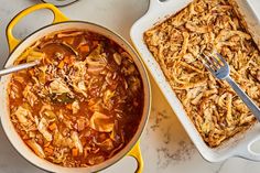 two pans filled with food sitting on top of a table