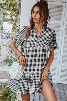 Our Genista Dress comes in a black & white tone check print. It features a v neckline and ruffle hem short sleeves for a relaxed comfortable fit. This gingham mini pairs beautifully with our heels or sandals for a fun casual look! Size Guide: Chloé is 5’7” tall, and has a 32.88” bust, 25.59” waist, & 36.2” hips. She is wearing a S / US 4 / AU 8. This dress is true to size. Material: 50% Viscose, 50% Polyester. Feature: Mini length. Relaxed fit. V neckline. Short sleeves. Maternity friendly. Plea Prom Dresses Boho, Long Summer Dresses Maxi, Summer Plaid, Outfits Dresses, Festival Tops, Dresses Ideas, Swimsuit Dress, Summer Party Dress, Prom Dresses Long With Sleeves