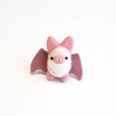 Fun and cute animal accessory. Woodland gift.Needle felted pink bat brooch. Miniature felt animal pin.Baby fuzz bats are very curious.They don't sleep and hide like the other bats do.Baby bats are looking for fun and want to stick with you wherever you go!This mini fuzz bat pin size is approximately H1.5"(3.8cm)  W2"(5cm)The bat is needle felted, the wing + pin are sewed on individually by me in U.S.A.*The one you will receive may not be the one in the pictures above. Since it is handmade, each Halloween Felt Crafts, Felt Woodland, Bat Light, Needle Felting Diy, Felt Halloween, Needle Felting Projects, The Wing, Miniature Animals, Needle Felted Animals