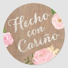 a round sticker with flowers and the words hello con carino written on it