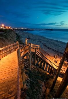 stairs leading down to the beach at night