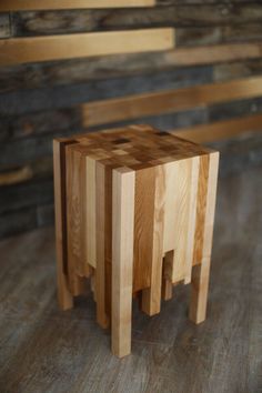 three wooden stools sitting on top of a hard wood floor