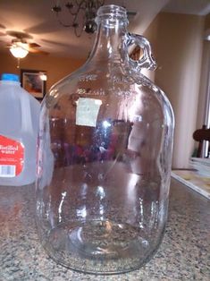 a large glass bottle sitting on top of a counter