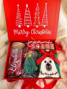 a red box filled with christmas treats and candies