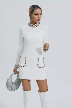 The Karina White Diamond Embellishment Mini Dress exudes opulence and grace. Adorned with diamonds along the neckline, cuffs, and pockets, this long-sleeved dress is a true statement piece. The colored gemstones add a touch of vibrancy, making this dress perfect for any special occasion.   Dress Length: Approx 83cm Materials: Polyester Gentle Dry Clean Only  Model is 5 ft 7 and wears size S  Colour may vary due to lighting on images. The product images (without model) are closest to the true col Film Festival Outfit, Homecoming Suits, Diy Cut Shirts, Embellished Shorts, Special Occasion Dress, Civil Wedding, Short Sleeve Mini Dress, Slim Dresses, White Blazer