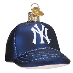 a new york yankees baseball cap ornament hanging from a ball chain on a white background