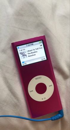 an ipod is hooked up to a blue cord