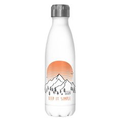 a water bottle with the words keep it simple in front of a mountain range and trees