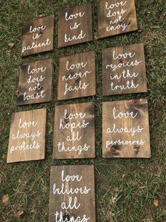 wooden signs that say love, hope, and other things are arranged on the grass