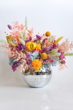 fuchsia yellow peach baby blue and mint green Dried Flower Arrangement in a Disco Mirror Ball Vase on a white background Flowers In Disco Ball, Disco Flowers Party, Colorful Disco Ball Wedding, Disco Ball Floral Centerpiece, Disco Ball Centerpiece Ideas Wedding, Disco Ball Florals, Disco Centerpiece Ideas, Coming Out Party Ideas, Disco Ball Floral Arrangement