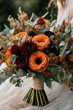 a bridal bouquet with red and orange flowers