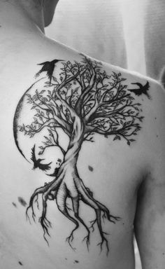 a man with a tree tattoo on his back