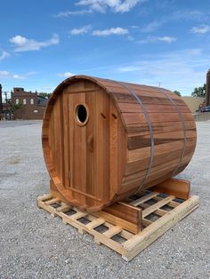 a wooden barrel sitting on top of a pallet