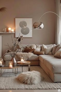 a living room filled with furniture and candles