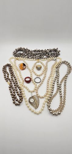 This is a lot of vintage costume jewelry. It contains mostly necklaces, faux pearls, rings, a ladies watch pendant (not working), and a bracelet.  Conditions vary. Some items have more wear than others and some may be broken. Some are in good condition. The watch does not work. It does not wind. Repurpose Jewelry, Watch Ring, Antique Costume Jewelry, Watch Pendant, Jewelry Watch, Vintage Beads, Ladies Watch, Jewellery Sets, Vintage Costume Jewelry