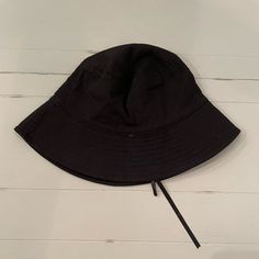 Black Bucket Hat Adjustable Tie Inside Never Worn Adjustable Black Cotton Sun Hat, Black Cotton Wide Brim Sun Hat, Black Cotton Bucket Hat With Curved Brim, Black Cotton Sun Hat With Curved Brim, Trendy Adjustable Black Bucket Hat, Black Brimmed Cotton Sun Hat, Black Cotton Brimmed Sun Hat, Black Spring Bucket Hat, Black Wide Brim Cotton Hat