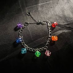 This handmade bracelet is made of a stainless steel chain and various rainbow acrylic dice charms. It is 6.5 to 9 inches long. Dice Jewelry, Dnd Crafts, Phone Things, Nose Jewelry, Waist Chain, Jewelry Repair, Handmade Bracelet, Steel Chain, Stainless Steel Chain