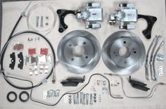 the brake assembly kit is laid out on a sheet