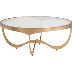 an oval glass table with gold metal legs