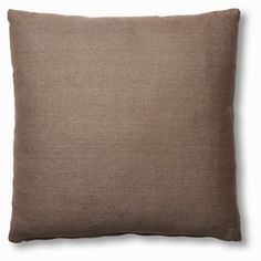 a brown pillow on a white background