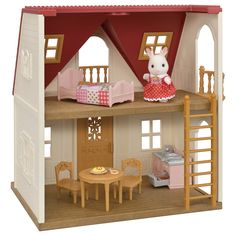 a doll house with furniture and accessories on the top floor, including a table and chairs