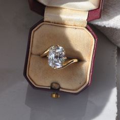 an engagement ring in a velvet box