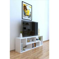 a white entertainment center with bookshelves and a painting on the wall