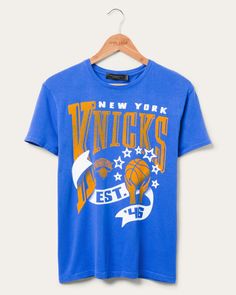 Women's Knicks Banner Vintage Tee | Junk Food Clothing Retro Cotton T-shirt With Team Logo, Throwback Graphic Print Top For Game Day, Retro Sports Fan Merchandise Tops, Retro Short Sleeve Tops With Team Logo, Throwback Sports Season Tops With Relaxed Fit, Throwback T-shirt With Team Logo, Throwback Graphic Print Tops For Sports Events, Vintage Crew Neck Top With Team Logo, Vintage Team Logo Tops For Streetwear